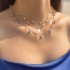 Cross border jewelry light luxury diamond inlaid blue devil's eye pendant collarbone chain fashionable temperament imitation pearl necklace for women