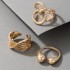 Amazon's new personalized accessory set featuring European and American fashion, cross shaped spiral geometric gold opening ring, three piece set