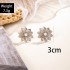 European and American retro silver iron flower inlaid pearl earrings with simple and elegant simulated flower temperament earrings and earrings