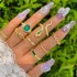 Cross border retro, personalized, fashionable metal imitation emerald, diamond studded heart-shaped snake shaped ring, multi piece set for women in Europe and America