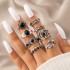 New European and American retro black gemstone inlaid nine piece ring set, geometric snake shaped crown leaf ring set