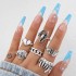 European and American punk dark butterfly skull hollow face ring multi piece set, personalized and trendy vintage ring set