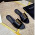 High end 2024 summer new one-piece slippers for women wearing flat bottomed metal letter buckle low heel foreign trade sandals