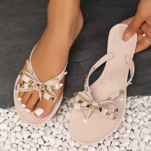 New European and American women's flat bottomed beach flip flops summer rivet bow slippers sandals sandals