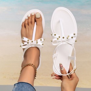 Cross border hot selling European and American foreign trade summer new flat bottomed PVC beach flip flops sandals anti slip PVC bow tie