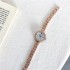 New fashion steel strip women's watch, student style simple retro ins style Korean version disc-shaped niche watch