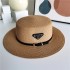 Korean version belt triangle metal logo grass woven hat for children's spring and summer fashion versatile vacation beach sun hat wholesale