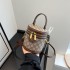 Round and simple bag for women with a sense of luxury 2024 new single shoulder diagonal cross hand-held fashion versatile retro high beauty bucket bag