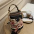 A dropshipping graffiti bucket bag for women 2024 new fashion niche round and simple bag, hand-held single shoulder diagonal cross women's bag