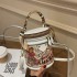 A dropshipping graffiti bucket bag for women 2024 new fashion niche round and simple bag, hand-held single shoulder diagonal cross women's bag