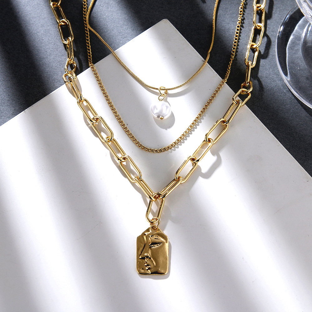 European and American cross-border new alloy multi-layer necklace, AliExpress creative pearl relief face pendant necklace wholesale