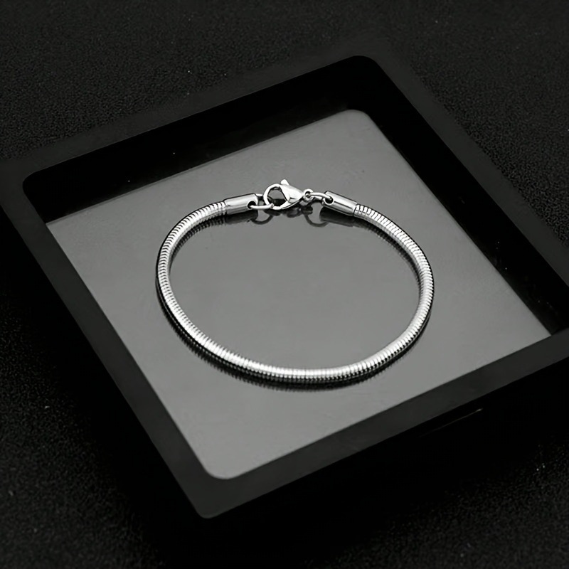 Cross border hot selling stainless steel round snake bracelet, European and American hip-hop men's personalized versatile snake chain, women's titanium steel bracelet wholesale