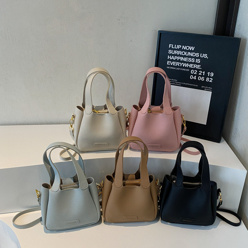 Korean version commuting handbag for women in spring 2025, new niche and simple bucket bag, fashionable and versatile single shoulder crossbody bag