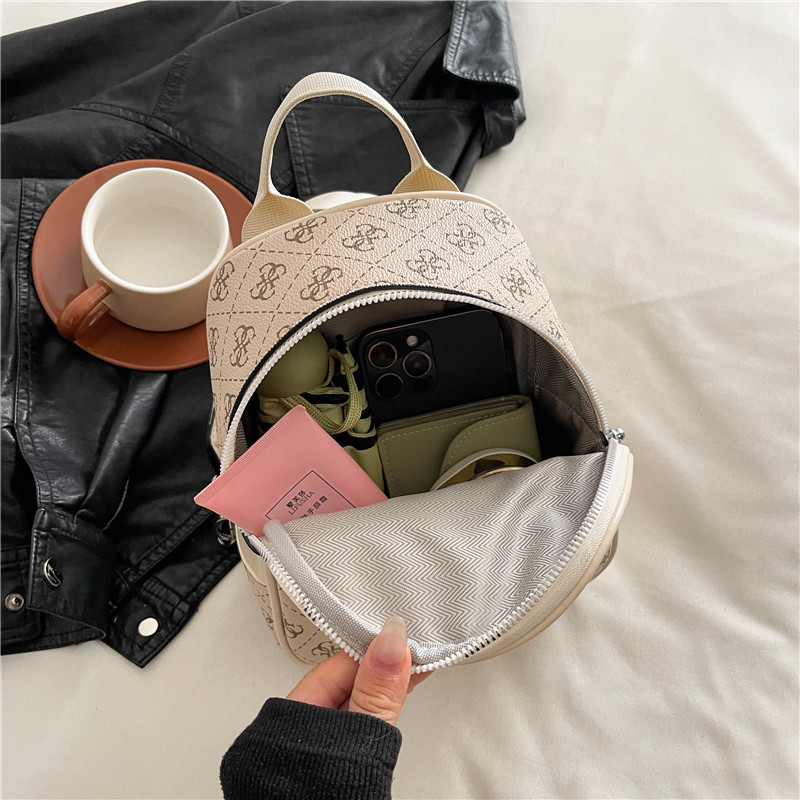 Cross border foreign trade women's bag printing 2025 new multi-purpose backpack, single shoulder diagonal cross hand-held chest bag, multi in one popular item
