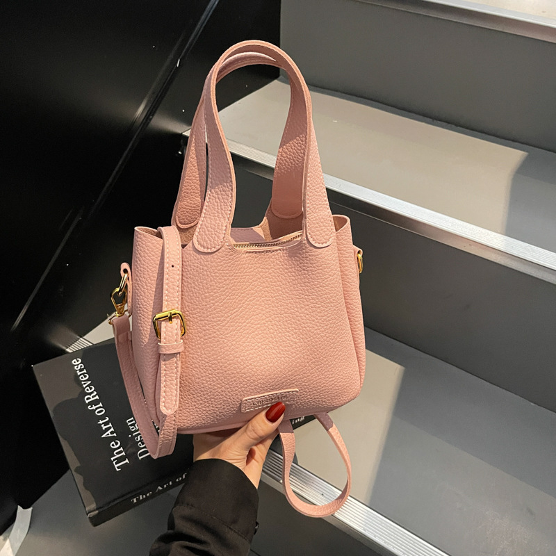 Korean version commuting handbag for women in spring 2025, new niche and simple bucket bag, fashionable and versatile single shoulder crossbody bag