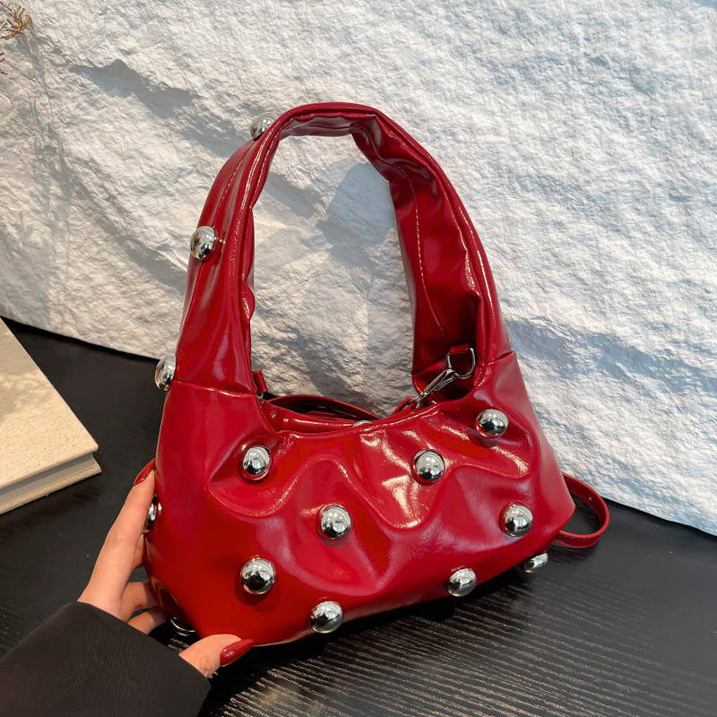 2025 new women's bag Korean version fashion rivet personality fashion niche shoulder bag Instagram internet famous crossbody armpit bag