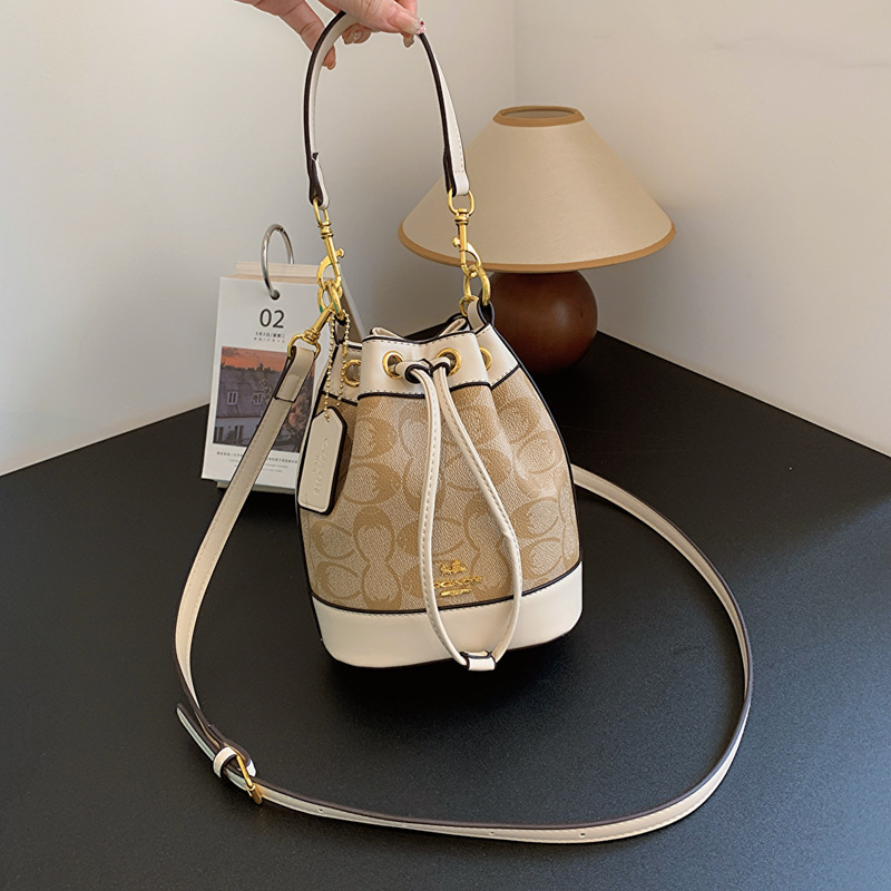 Koujia's new boutique vintage flower bucket bag for women, 2025 new retro diagonal cross bag, fashionable and versatile drawstring handbag