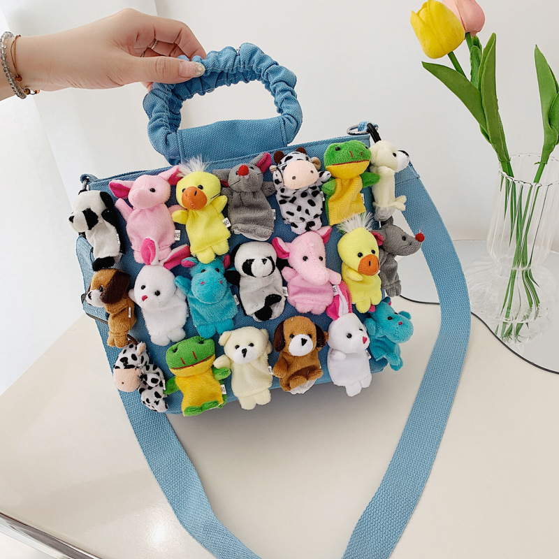 Cartoon canvas bag 2025 new soft girl cute doll funny large capacity single shoulder pleated handbag