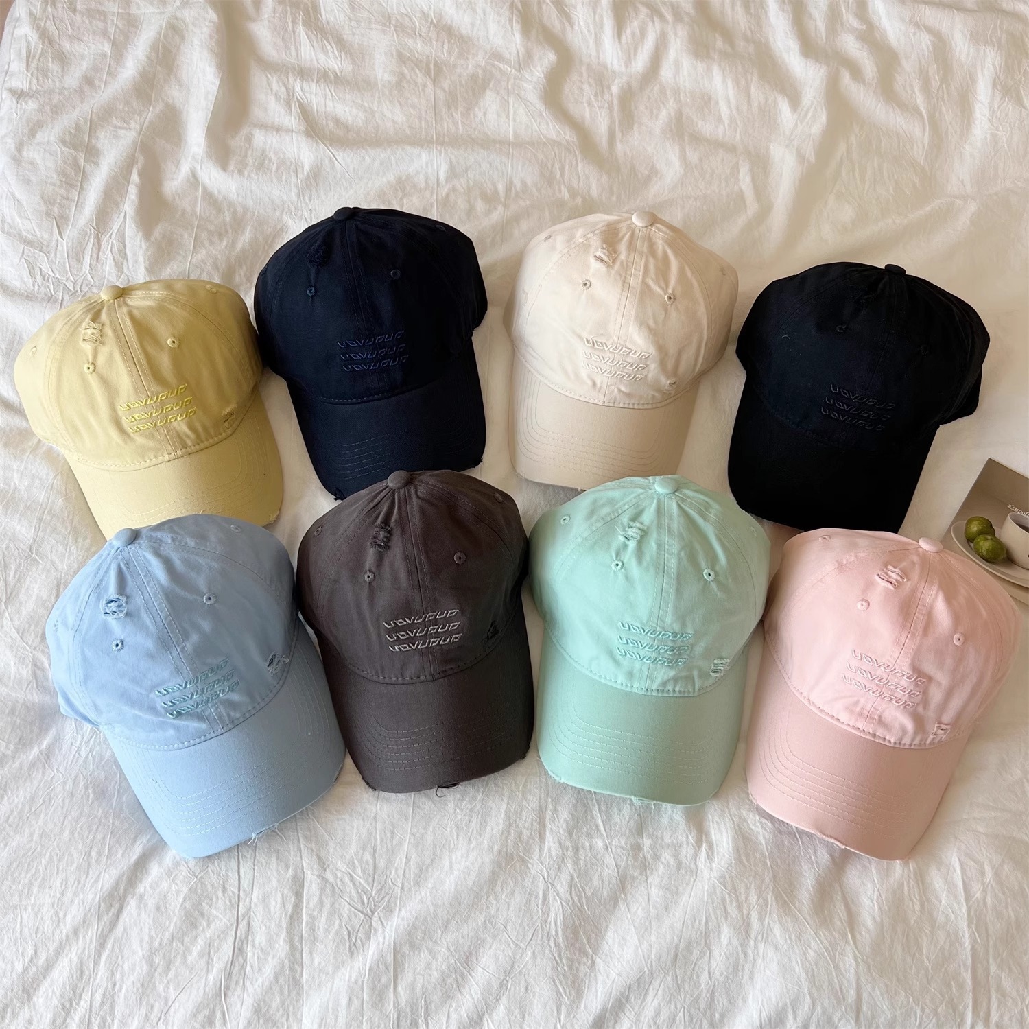 Macaron colored perforated letter baseball cap for women in spring and summer of 2025, new wide brimmed hat with small face and soft top, sun shading duckbill cap