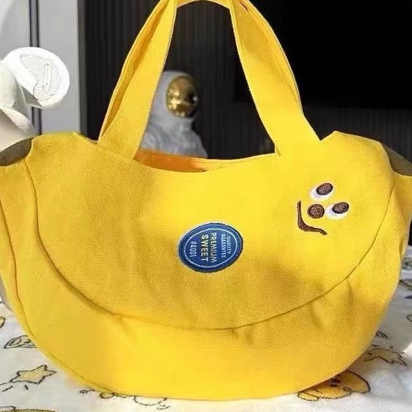 Cute and innovative banana bag with cartoon embroidery canvas bag for office workers, convenient handbag for moms to carry when going out Cute and innovative banana bag with cartoon embroidery canvas bag for office workers, convenient handbag for moms to carry when going out