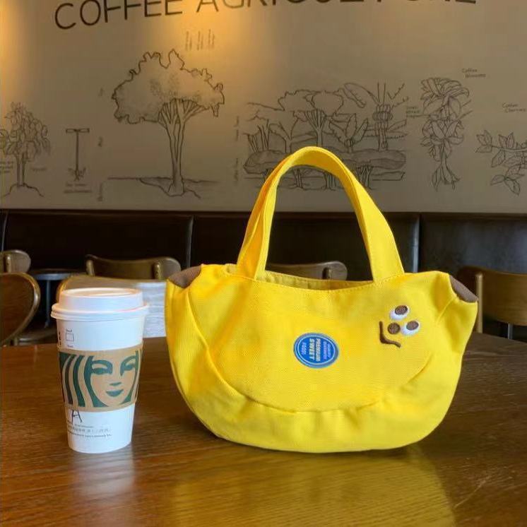 Cute and innovative banana bag with cartoon embroidery canvas bag for office workers, convenient handbag for moms to carry when going out Cute and innovative banana bag with cartoon embroidery canvas bag for office workers, convenient handbag for moms to carry when going out