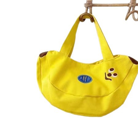 Cute and innovative banana bag with cartoon embroidery canvas bag for office workers, convenient handbag for moms to carry when going out Cute and innovative banana bag with cartoon embroidery canvas bag for office workers, convenient handbag for moms to carry when going out
