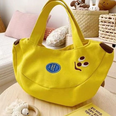 Cute and innovative banana bag with cartoon embroidery canvas bag for office workers, convenient handbag for moms to carry when going out Cute and innovative banana bag with cartoon embroidery canvas bag for office workers, convenient handbag for moms to carry when going out