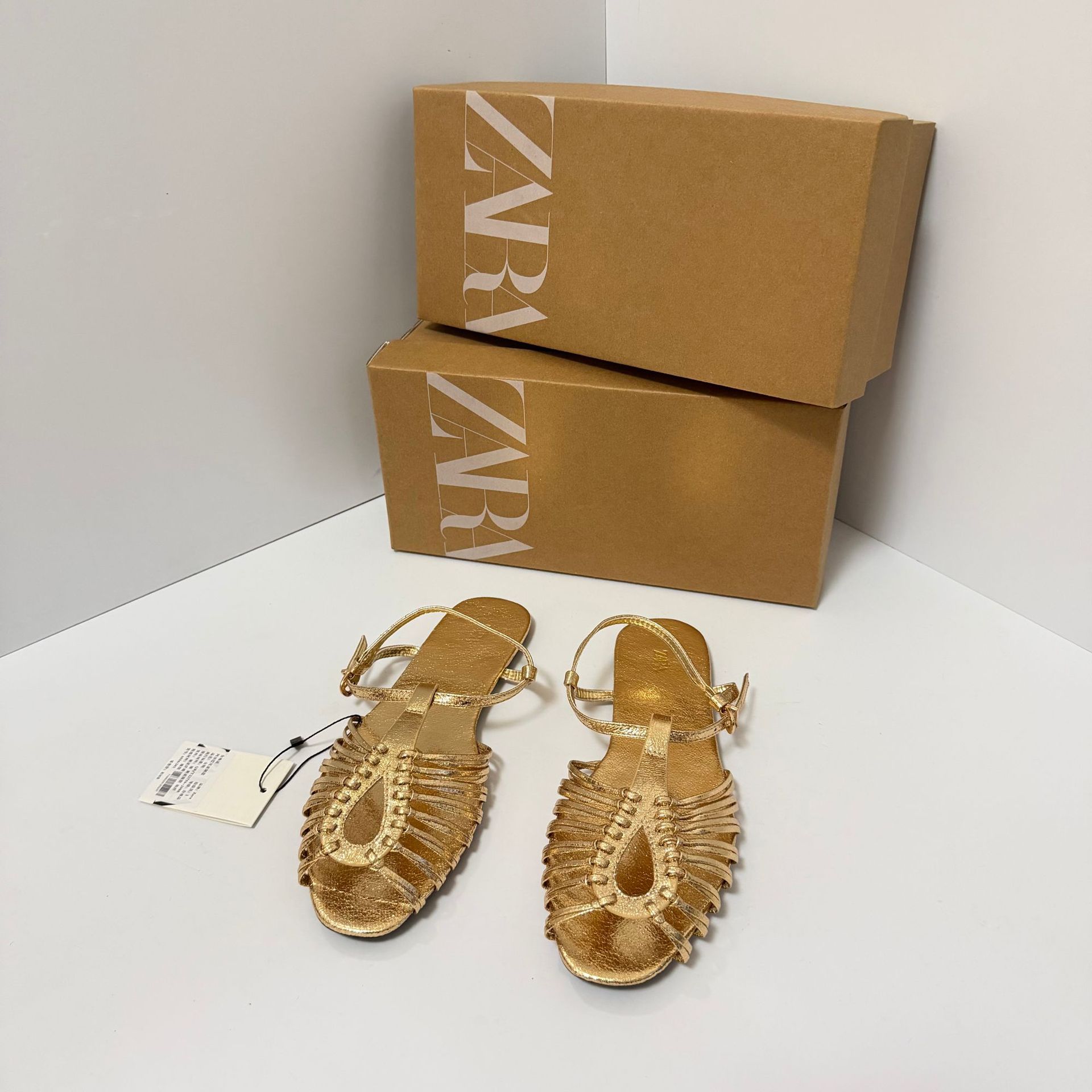 Za2026 new woven strap hollowed out flat bottomed beach sandals for women's summer, soft soled comfortable one-piece Roman shoes
