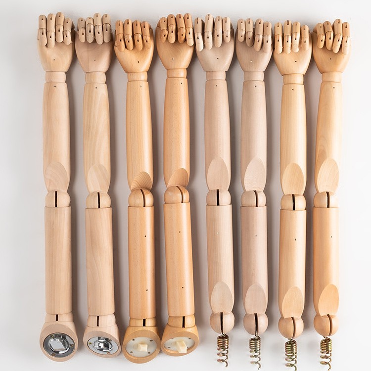 Model props, male and female children's accessories, electroplated spring pendants, rotating wooden solid wood arms, plastic arms display