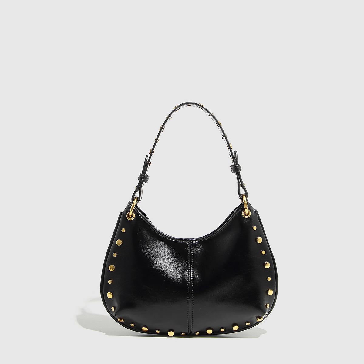 Classic saddle bag, new punk rivet armpit bag, large capacity commuting PU leather shoulder bag, hollowed out chicken eye women's bag