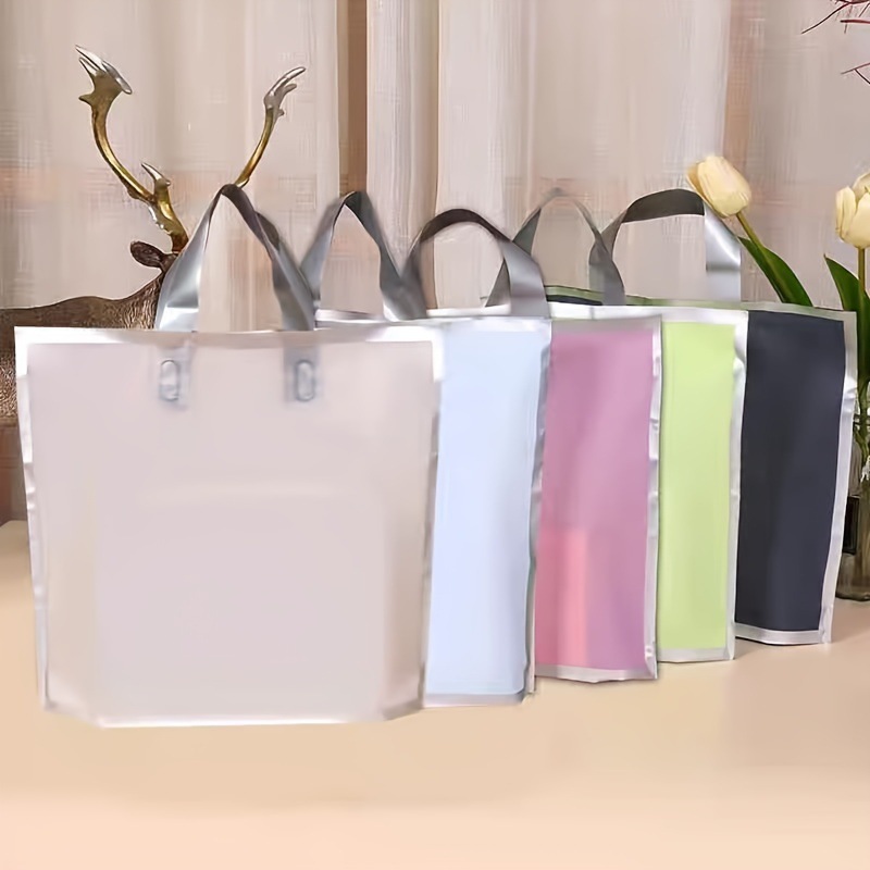 Cross border gift bags, shopping bags, new hand-held clothing, plastic makeup bags for women's clothing, children's clothing bags, shoe washing bags