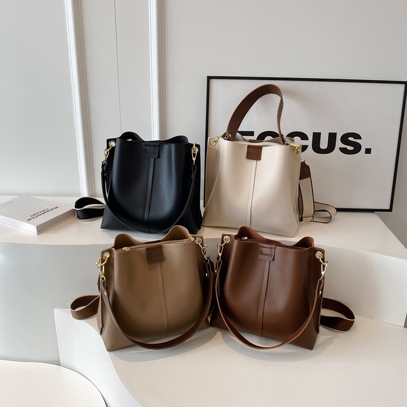Cross border new retro shoulder bag PU texture contrasting color hand-held bucket bag large capacity casual versatile crossbody bag for women