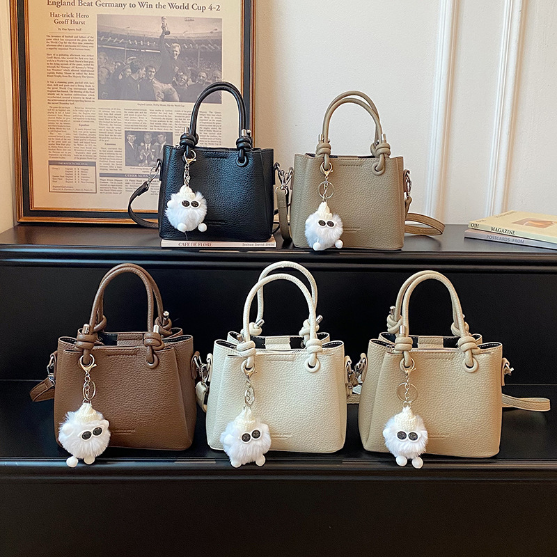 Cross border bucket bag for women 2026 new niche design lychee pattern handbag, simple and versatile single shoulder crossbody bag