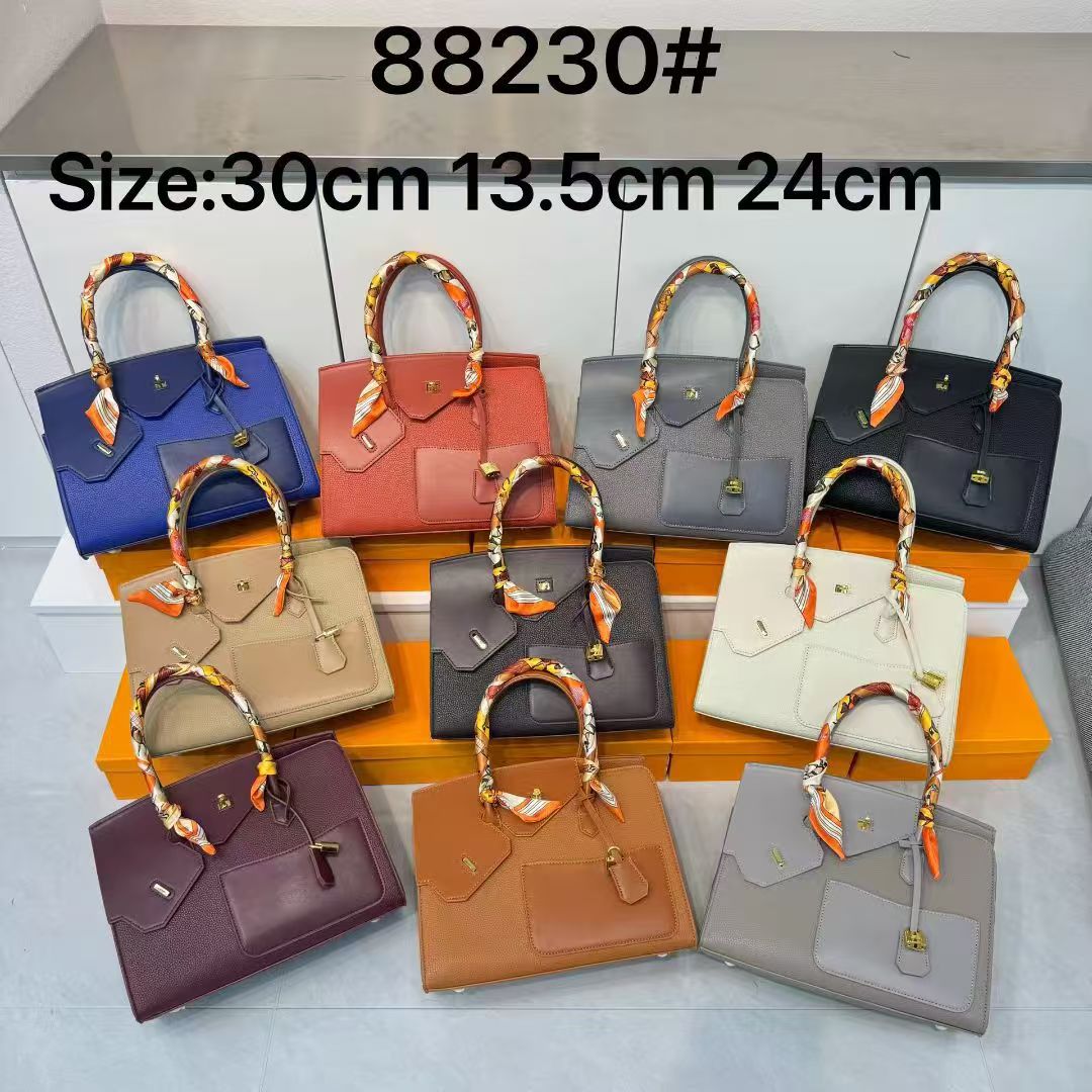 2026 high-end new spliced platinum bag 30cm double-sided irregular leather women's bag premium feel hand-held pocket bag