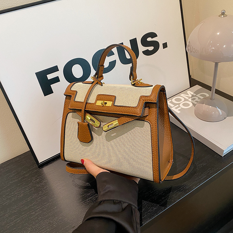 Korean version versatile fashion bag for women 2026 new style simple handbag with contrasting colors, large capacity single shoulder crossbody bag wholesale